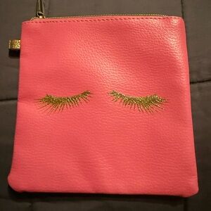 Pink Pouch with Gold Eyelash Design